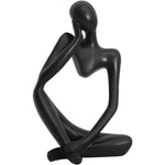 statue décorative moderne figure humaine assise couleur or noir beige.texture granuleuse surface lisseintérieur moderne