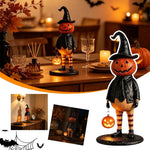 figurine citrouille halloween orange chapeau robe noire bas sculptée décoration intérieure festive