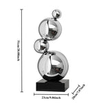 Sculpture décorative moderne or argent sphères polies métal base noire minimaliste