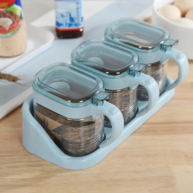 boîtes épices transparentes verre moderne rose verte bleu poignées couteau service herbes condiments cuisine