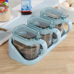 boîtes épices transparentes verre moderne rose verte bleu poignées couteau service herbes condiments cuisine