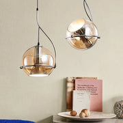 lampe suspendue moderne or argentée globe translucide structure métallique noir led