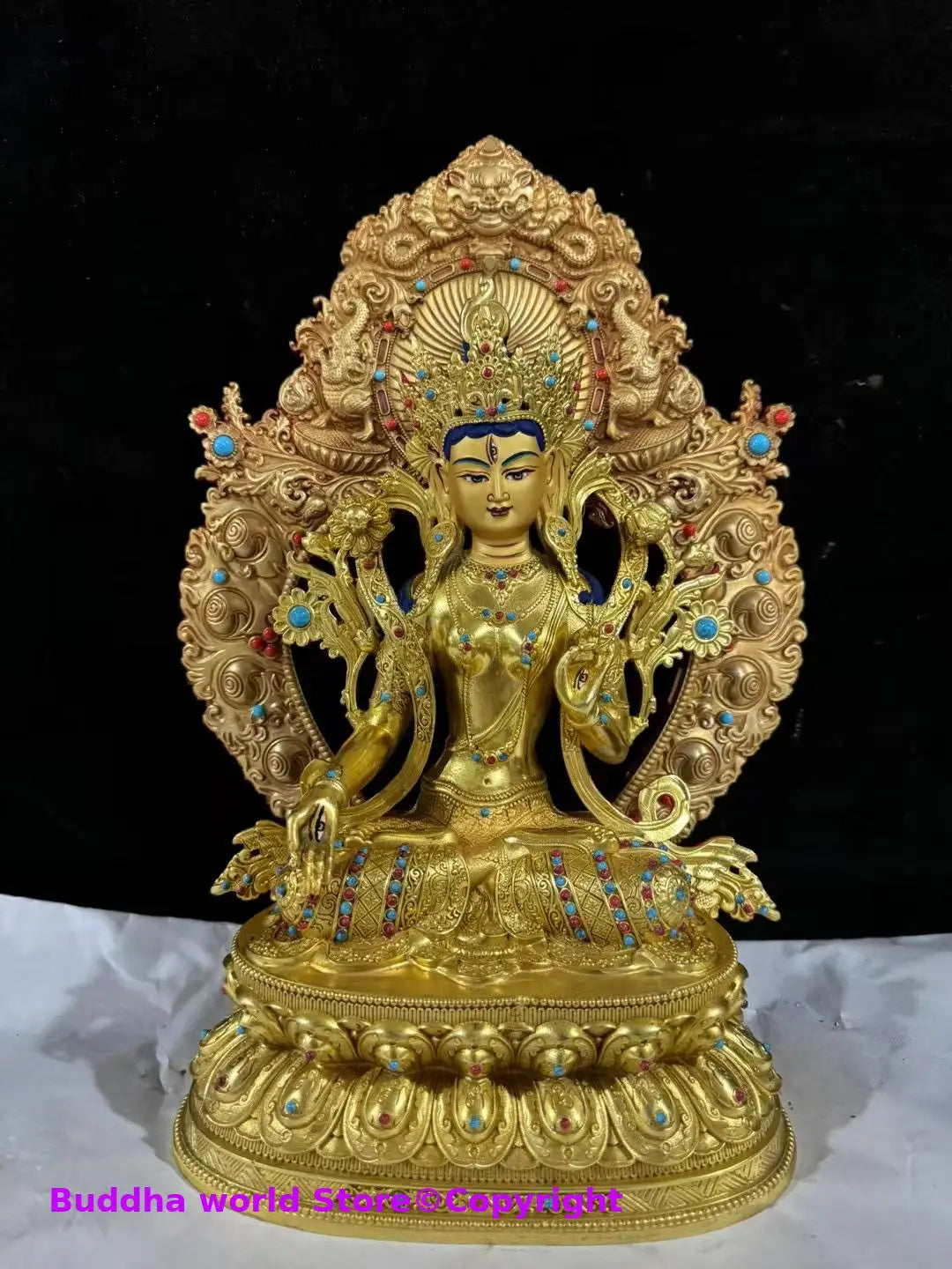 statue bouddhiste or bleu rouge turquoise décoration florale tibétain multiple bras base lotus