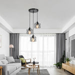 suspension industrielle moderne trois lumières abat jours métalliques noir doré adjustable