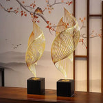 sculpture décorative feuille stylisée or noir moderne minimaliste ajourée asiatique fixée socle bois