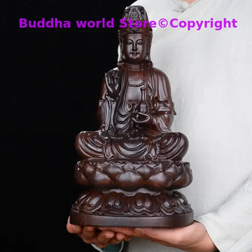 statue bouddhiste traditionnelle bois sculpté détails complexes position assise socle lotus marron foncé protection