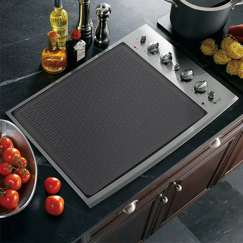 tapis protection silicone antidérapant chauffe plaque induction noir rayures horizontales moderne adhésif respectueux environnement