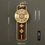 horloge murale chinoise bien être or bois fixation cadran métal motif caractère