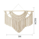tapisserie macramé boho chic motifs géométriques franges beige clair tige bois crochets métalliques