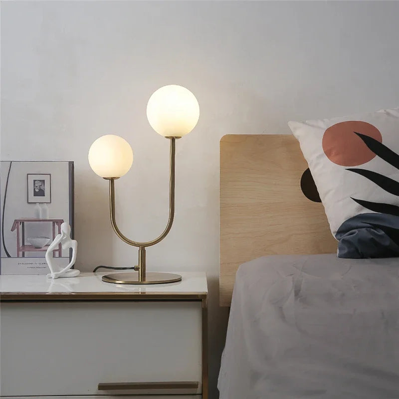 lampe table moderne or blanc sphères translucides câble noir base plate
