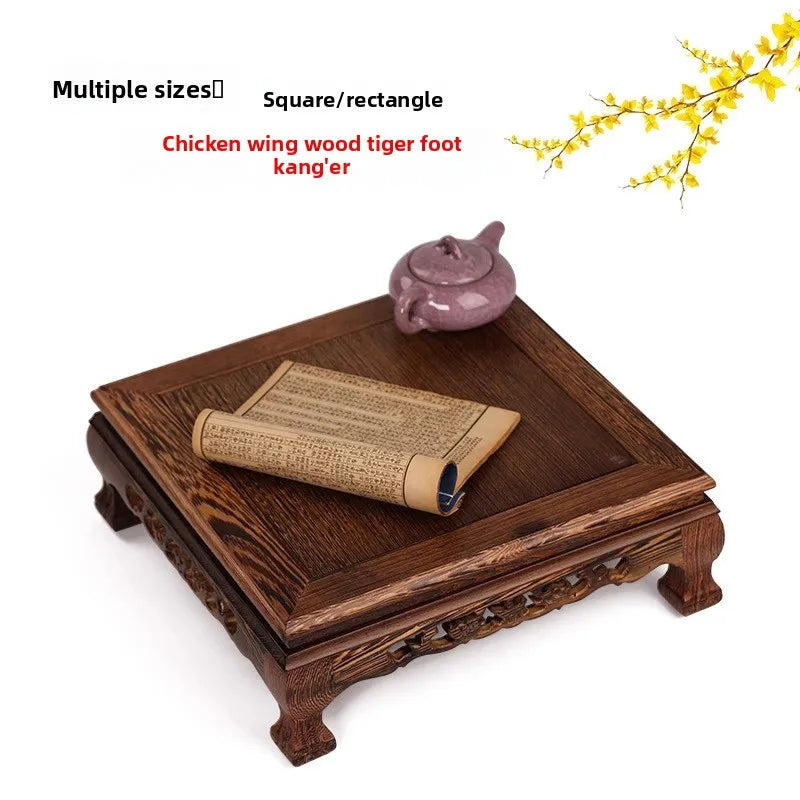 table basse bois sculptée asiatique traditionnel motifs animaux pieds decoration marron foncé rouleau papier
