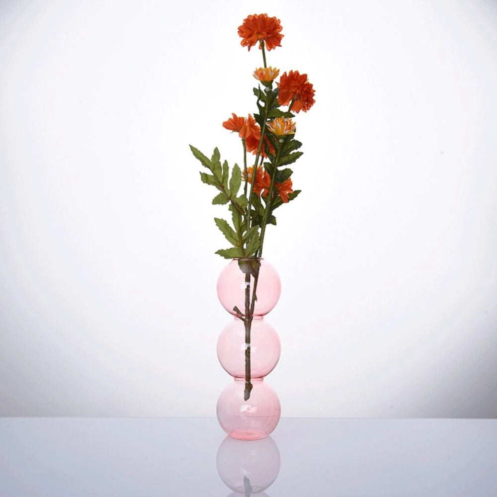 vase moderne transparent sphères empilées jaune clair rose bleu vert brun