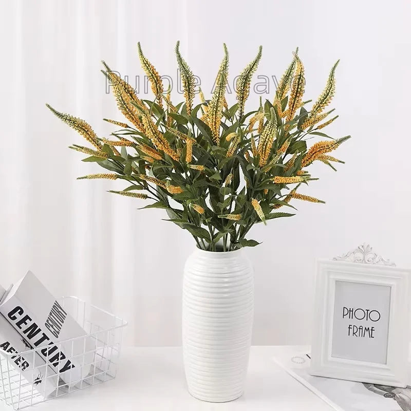 décoration intérieure moderne bouquet artificiel violet vert petites fleurs cônes feuilles vertes plastique