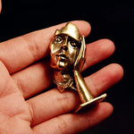 statuette abstraite dorée sculpture visage stylisé moderne décoration salon maison