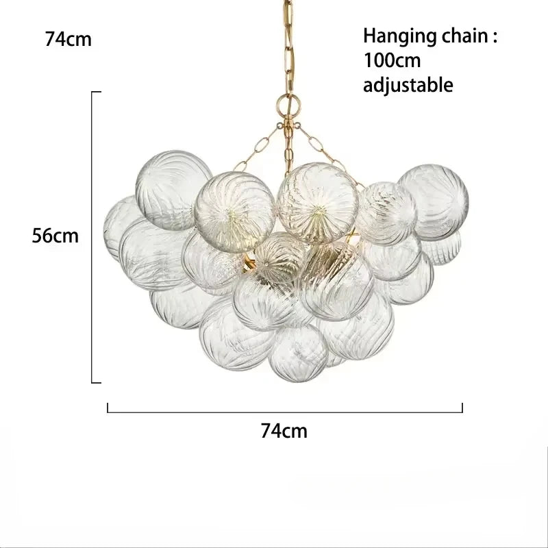 suspension lumineuse moderne verre transparent chaîne dorée led acier poli contemporain lumière chaude chambre