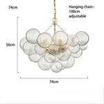 suspension lumineuse moderne verre transparent chaîne dorée led acier poli contemporain lumière chaude chambre