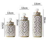 vases décoratifs modernes motifs géométriques or blanc couvercle transparent élégants intérieurDecoration