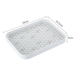 plateau rangement blanc moderne grille perforations tasse thé théière fruits tapis sol écologique