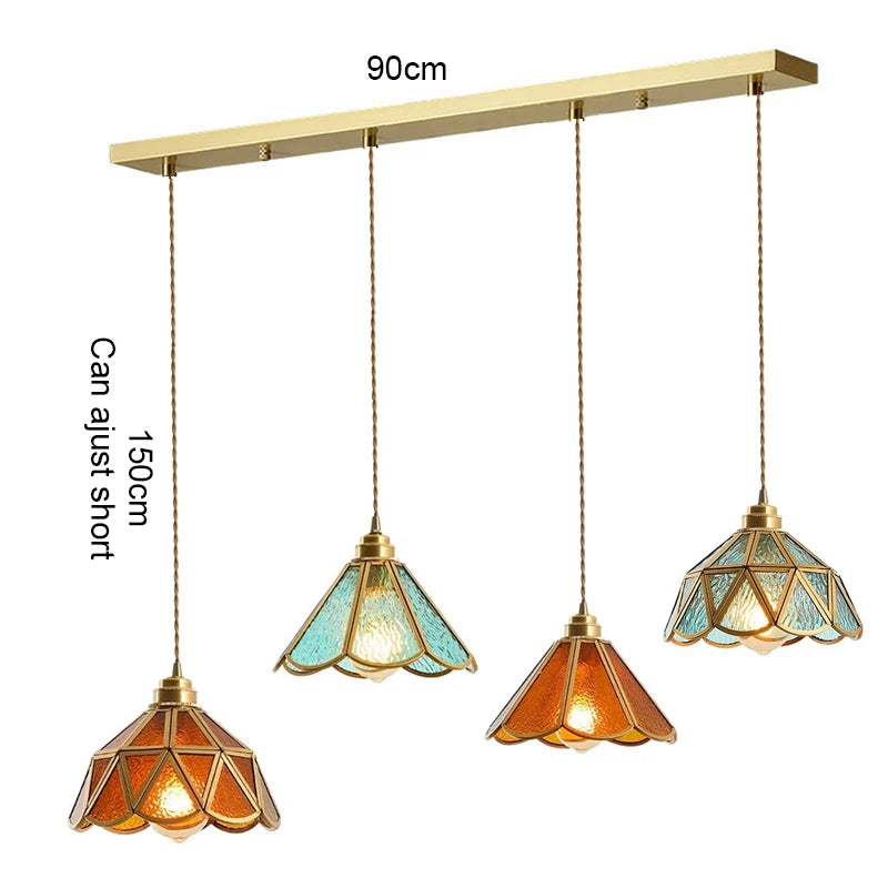 suspension lumineuse verre teinté art deco or marron bleu clair motifs géométriques opacité chaînes