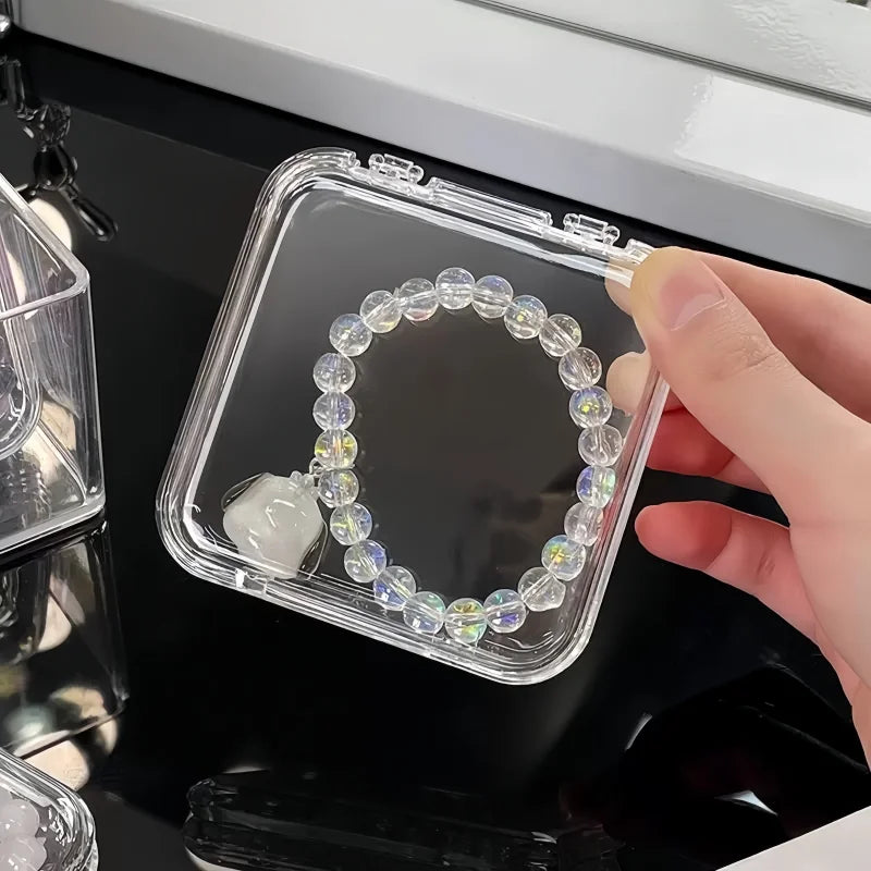 organisateur maquillage blanc transparent boîtes rangement compartiments moderne élégant pinceaux rouges lèvres bijoux soins