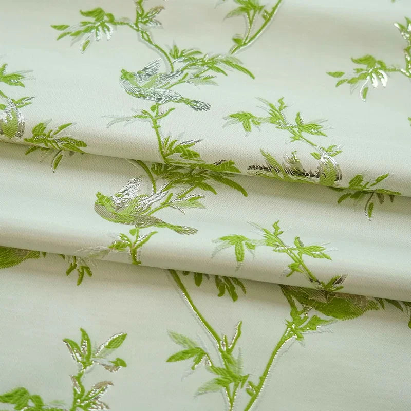 tissu brocart vert feuilles branches oiseaux motifs decoratifs polyester large 150cm variable opacity floral