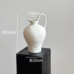 vase poterie moderne gris beige fleur séchée décoration intérieure texture marbrée lisse rustique arrangement
