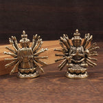 statue bouddhiste traditionnelle bronze doré détails sculptés surface lisse deux figures multiples bras