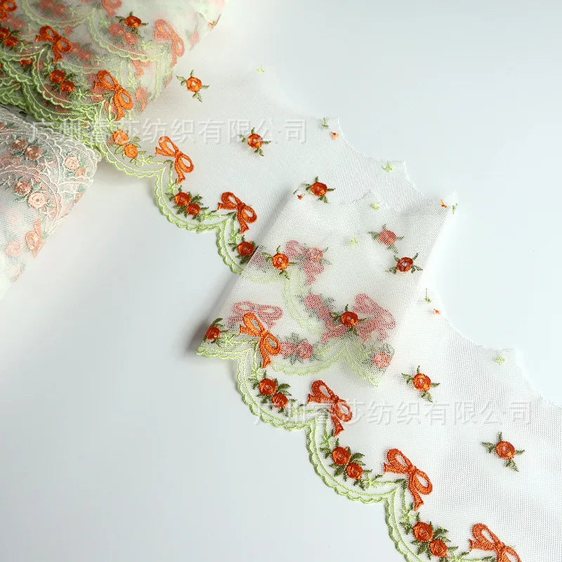 tissu polyester dentelle broderie fleurs rubans bordure élégant blanc orange vertclair 11cm 3mètres translucent