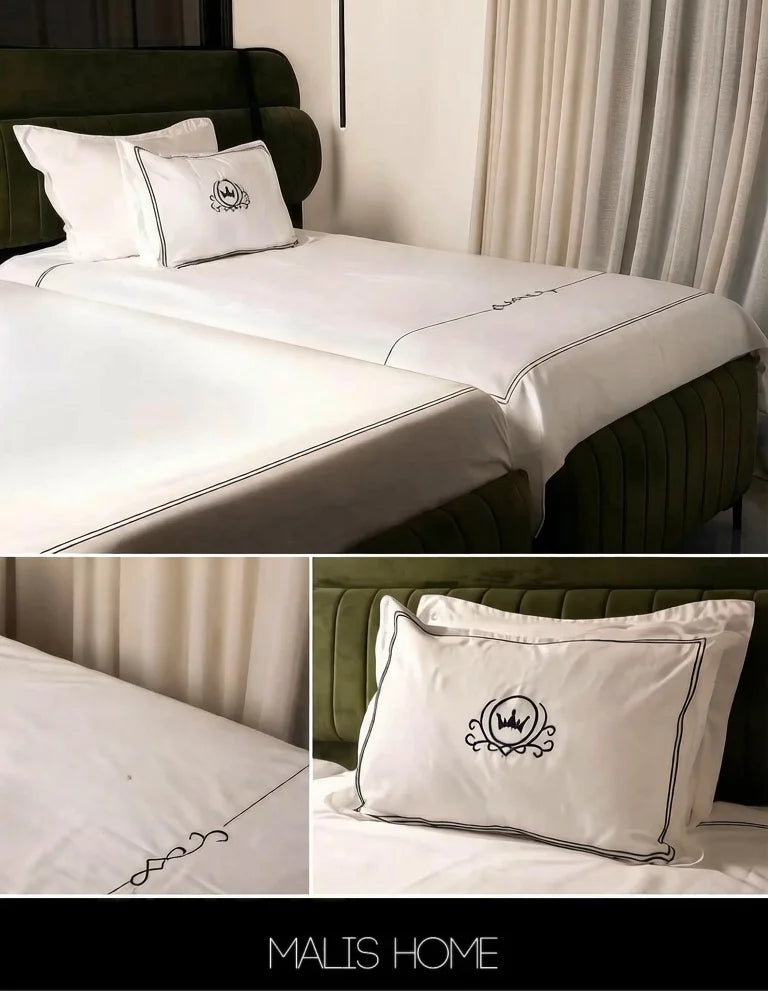draps coton brodés couronne élégants oreillers couette literie chambre blanc motifs floraux
