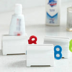 support mural blanc rouge bleu vert tube dentifrice moderne pratique salle bain organisateur anti