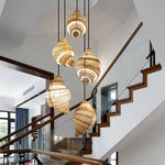 suspension lumineuse tissu spirale moderne beige marron clair câble suspendu chambre salon étude