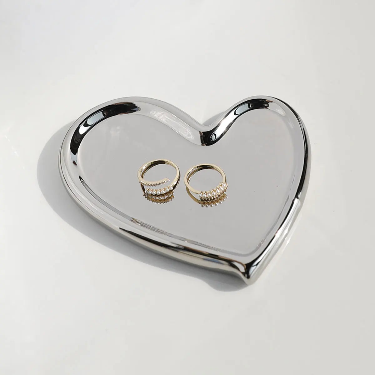 support bijoux argenté moderne plateau lisse brillant rangement clés ornement
