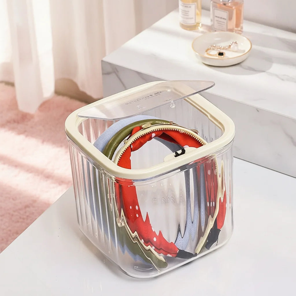 boîtes rangement accessoires cheveux transparentes poignées blanches rayures verticales moderne minimaliste femmes domestique
