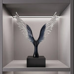 sculpture oiseau moderne minimaliste noir argenté plumes stylisées transparent salon