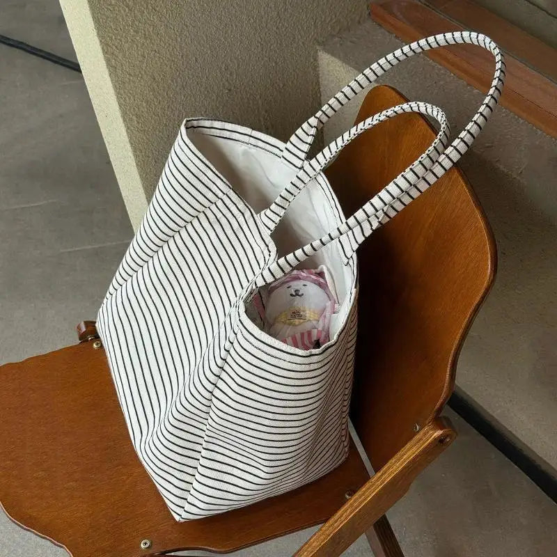 sac main blanc noir rayures horizontales poignées détachables intérieur beige casual