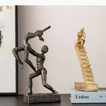 sculpture moderne danseurs figures humaines interaction dynamique penseur livres étagère decoration abstraite chaleur coloris