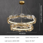suspension lumineuse moderne dorée transparente disques circulaires texture rugueuse contemporaine élégante chaînes suspendues LED