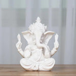 statue ganesha résine sculptée décorative religieuse éléphant fleurs blanches maison