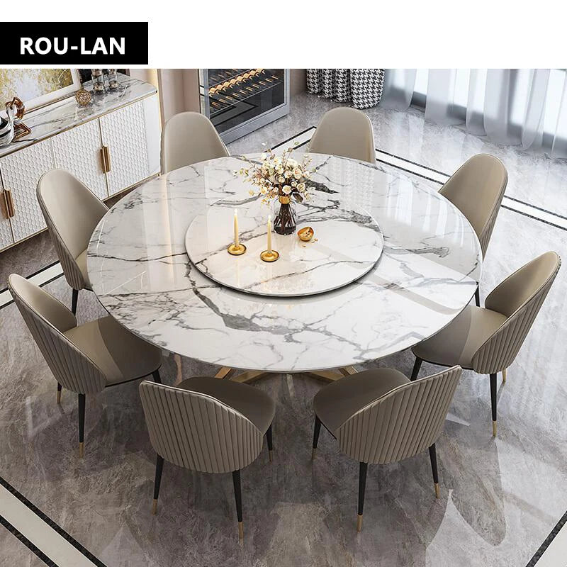 table ronde moderne marbre imitation blanc chaises gris clair pieds dorés textures luxueuses salles