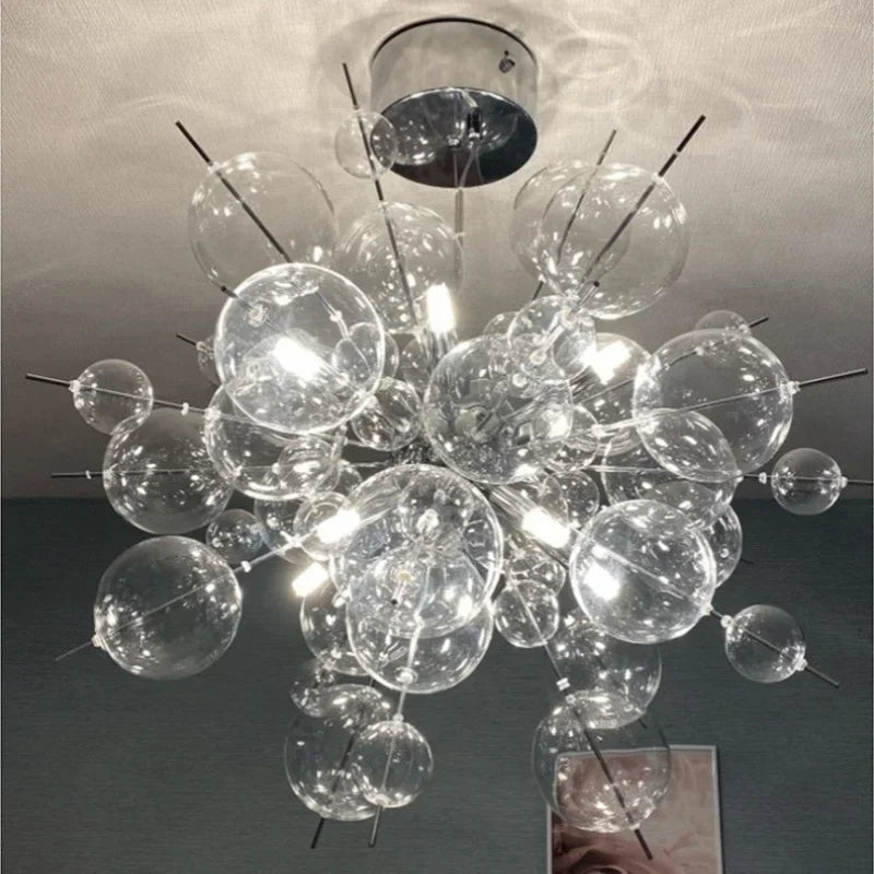 suspension lumineuse moderne boules sphériques transparentes dorées argentées câble suspension intérieur chambre salonhôtel