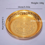 assiettes decoratives ornementales emailees motifs floraux geometriques opalescentes artisanat traditionnel bouddhiste