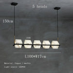 suspension lumineuse moderne marbre noir blanc or rose fixée câbles chambre salon
