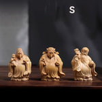 statues sculptées bois naturel artisanal traditionnel trois pièces bébé motifs floraux géométriques maison chambre