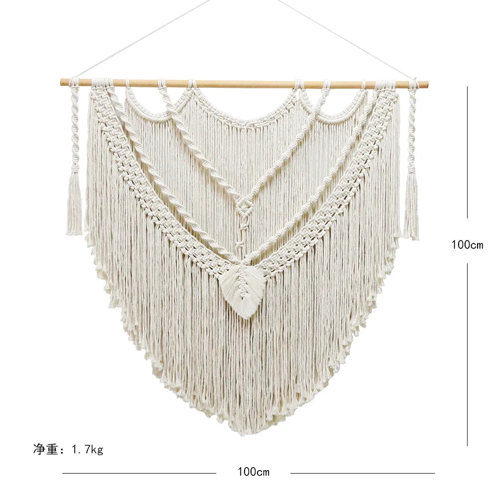 tapisserie macramé boho chic motifs géométriques franges beige clair tige bois crochets métalliques