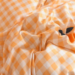 Ensemble literie orange avec drap plat et taies d'oreiller