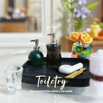 ensemble toilettes miniature résine moderne brosse dorée serviette blanche distributeur savon noir gel douche