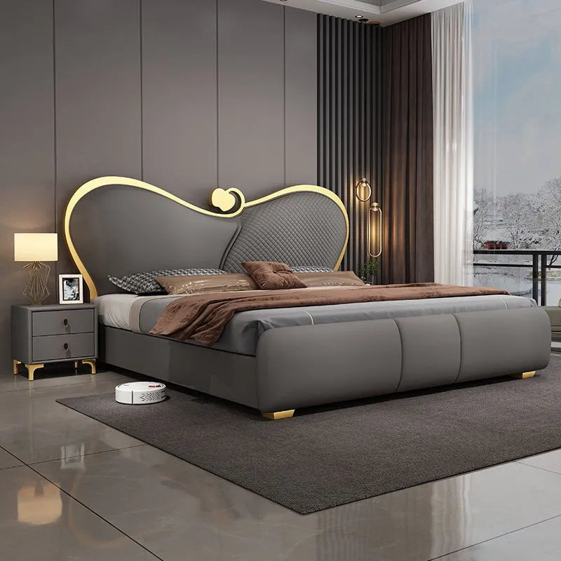 lit double moderne gris capitonné table chevet oreillers tapis luxueux