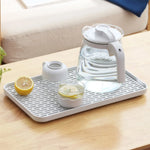 plateau rangement blanc moderne grille perforations tasse thé théière fruits tapis sol écologique