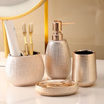 ensemble salle bain moderne or pâle brosse dents savon tube crème blanche distributeur