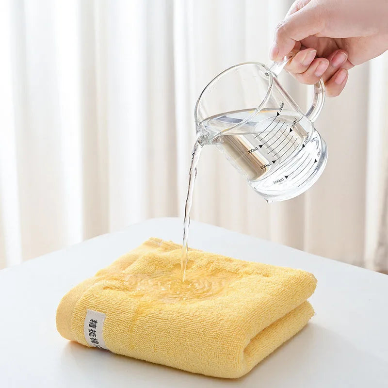 serviettes bain coton douces absorber vert clair jaune gris orange blanc texture duveteuse moderne
